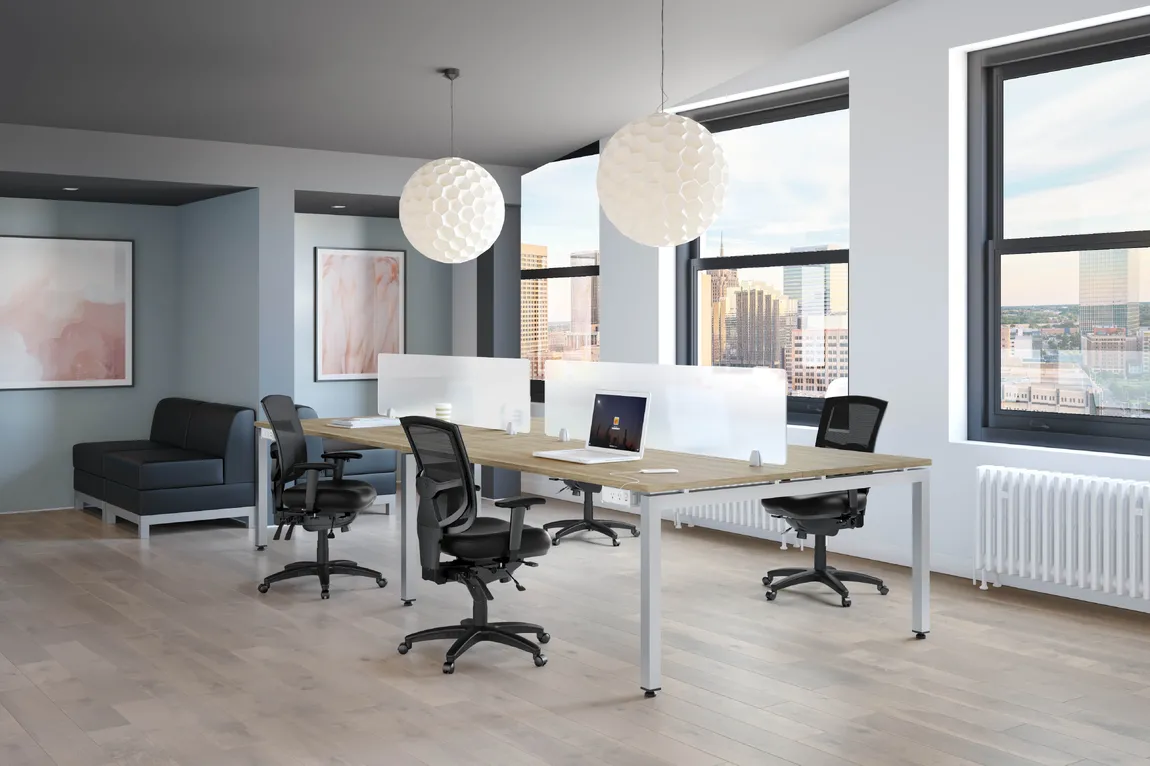 Four person desk with frosted glass divider.